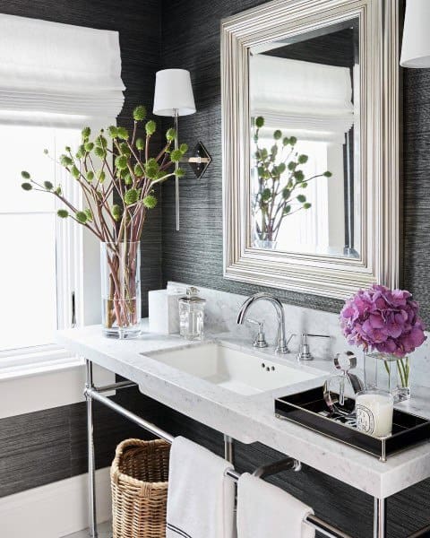 marble bathroom sink with framed mirror