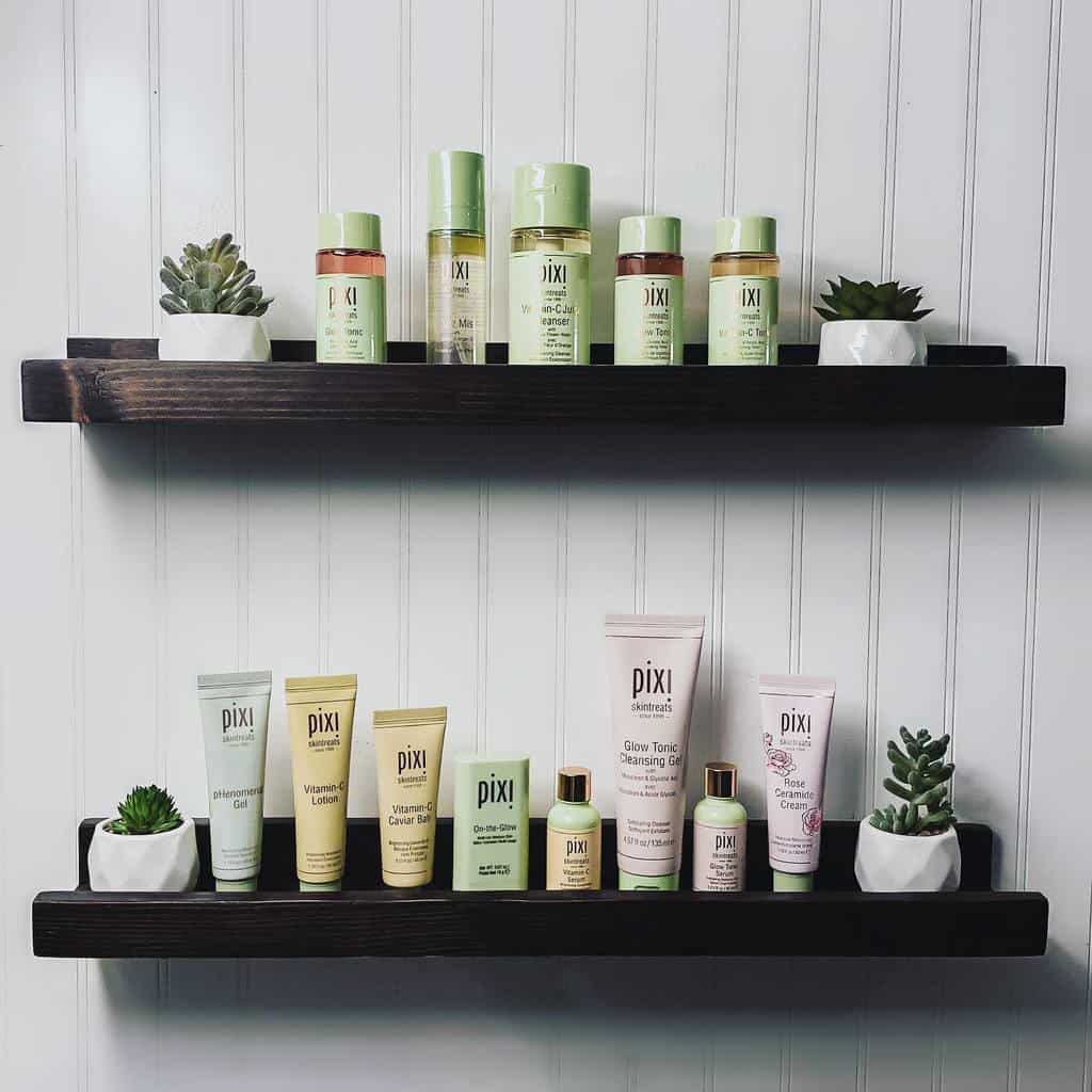 black bathroom wall shelves holding toiletries 