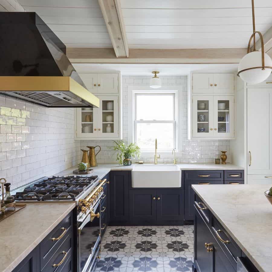 country kitchen gray cabinets gold accents apron sink white wall tiles 