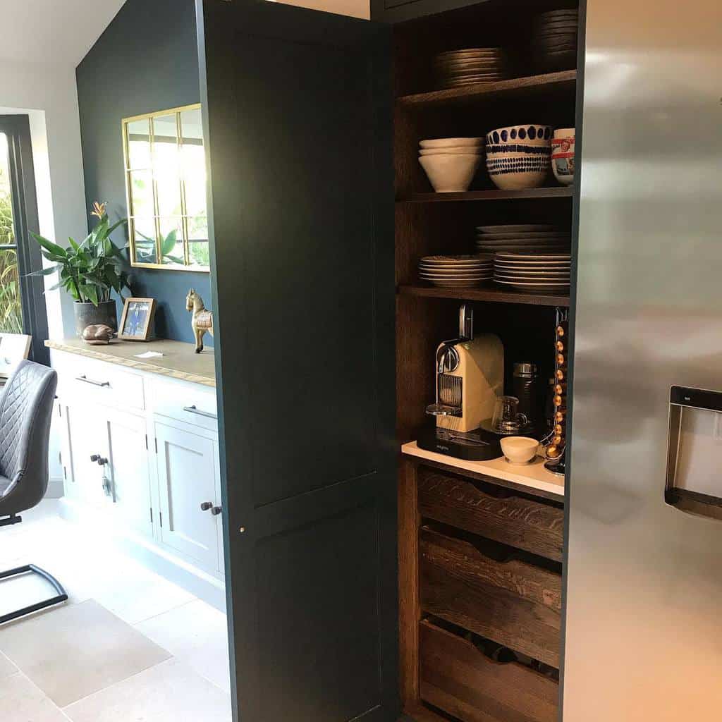 vintage wood kitchen cabinet hidden behind silver doors