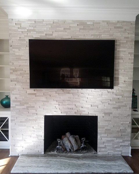 textured stone fireplace tiles