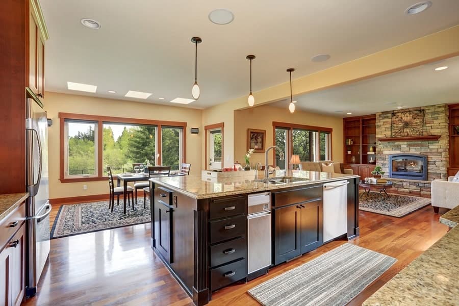 large country kitchen with island containing sink 