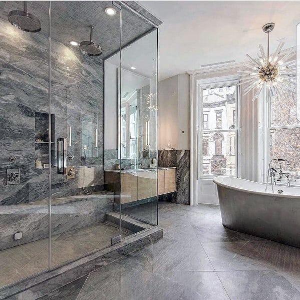 elegant master bathroom in apartment with shower bench