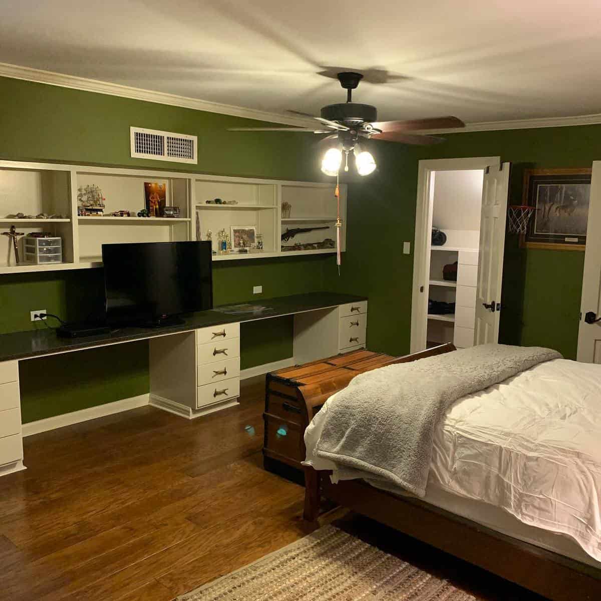 large bedroom white cabinets wall shelves wood bed chest 