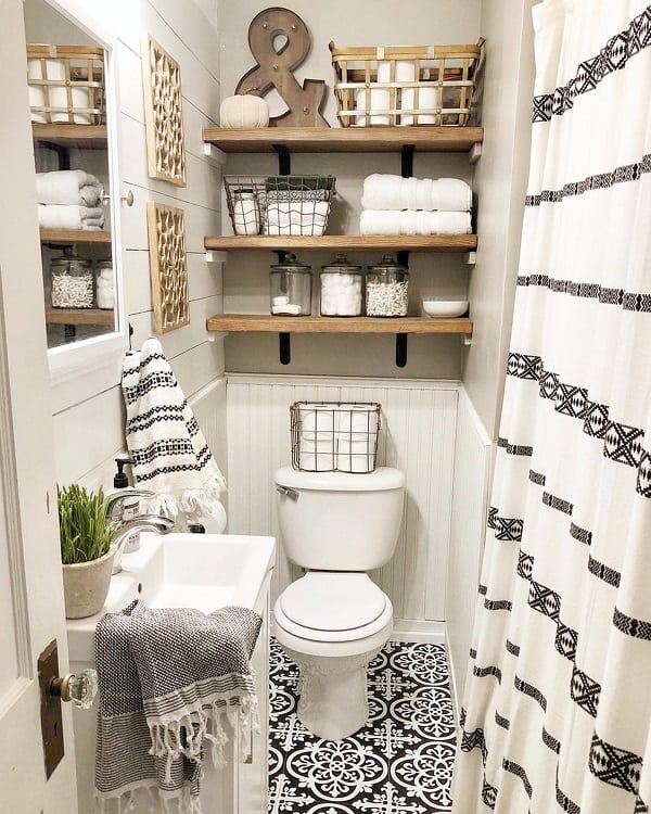 small farmhouse master bathroom with wood shelves storage 