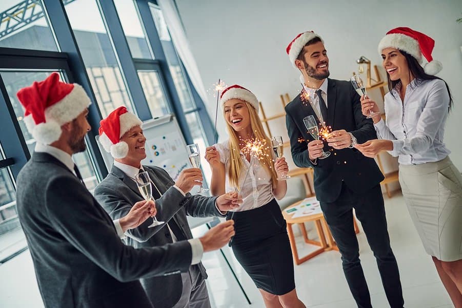 office workers celebrating winter holidays