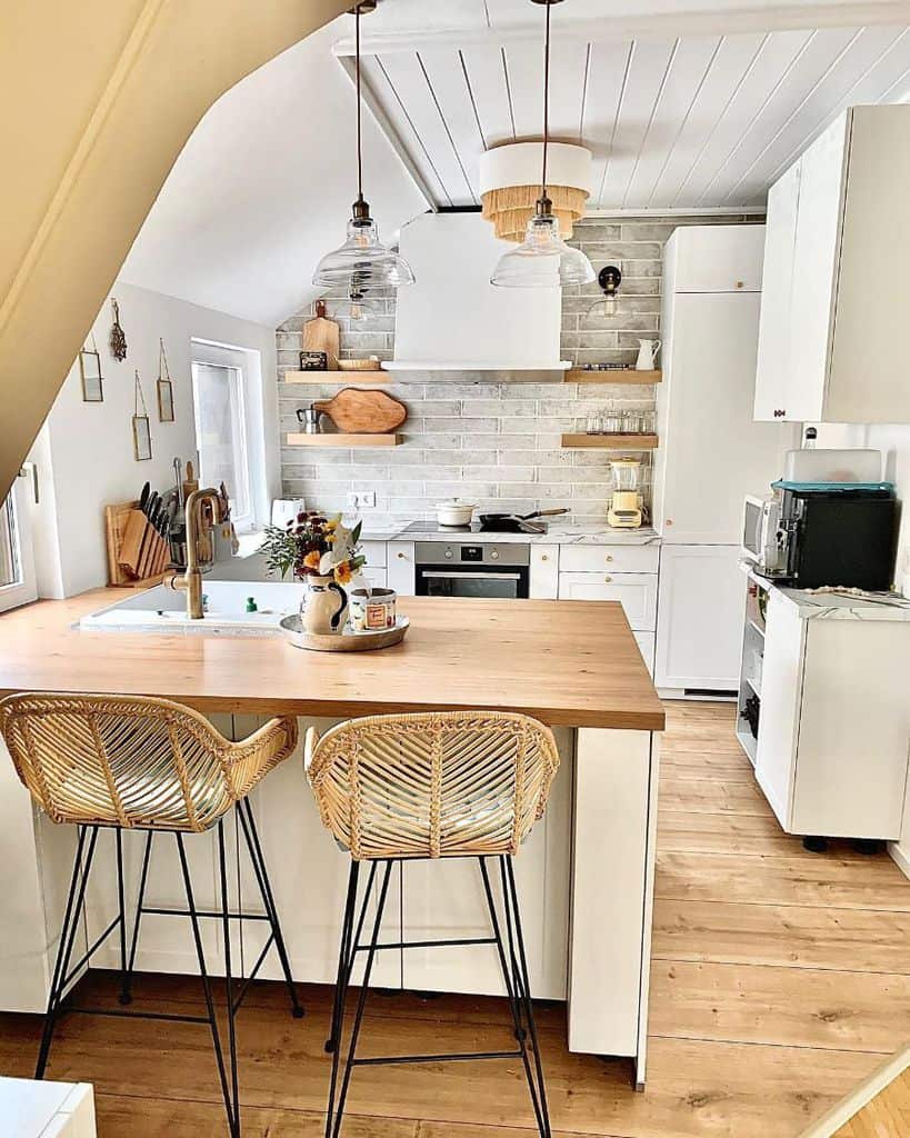 open shelves kitchen rustic kitchen white cabinets wood countertop cane chairs 