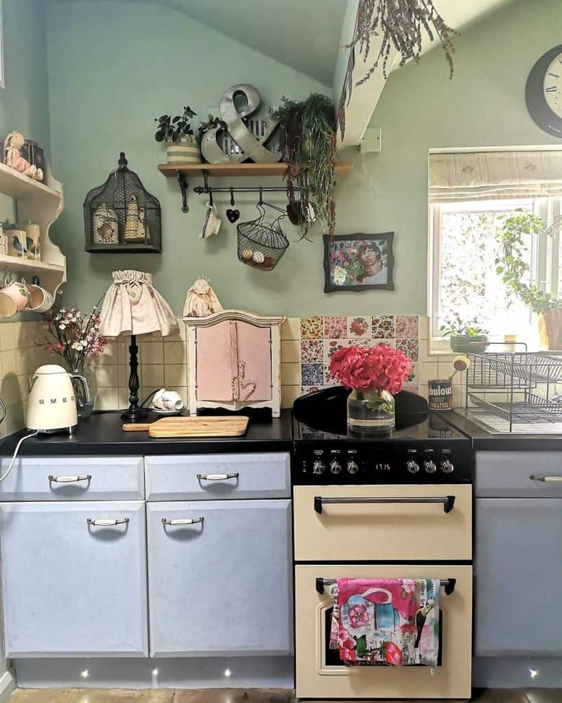 rustic kitchen blue cabinets white tiles green accent wall floating wall shelf 