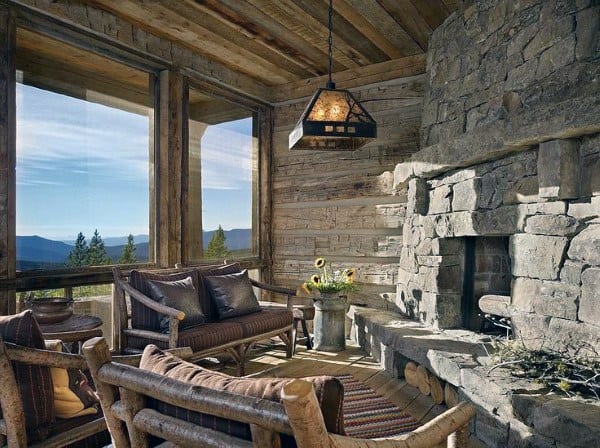 rustic stone fireplace sunroom