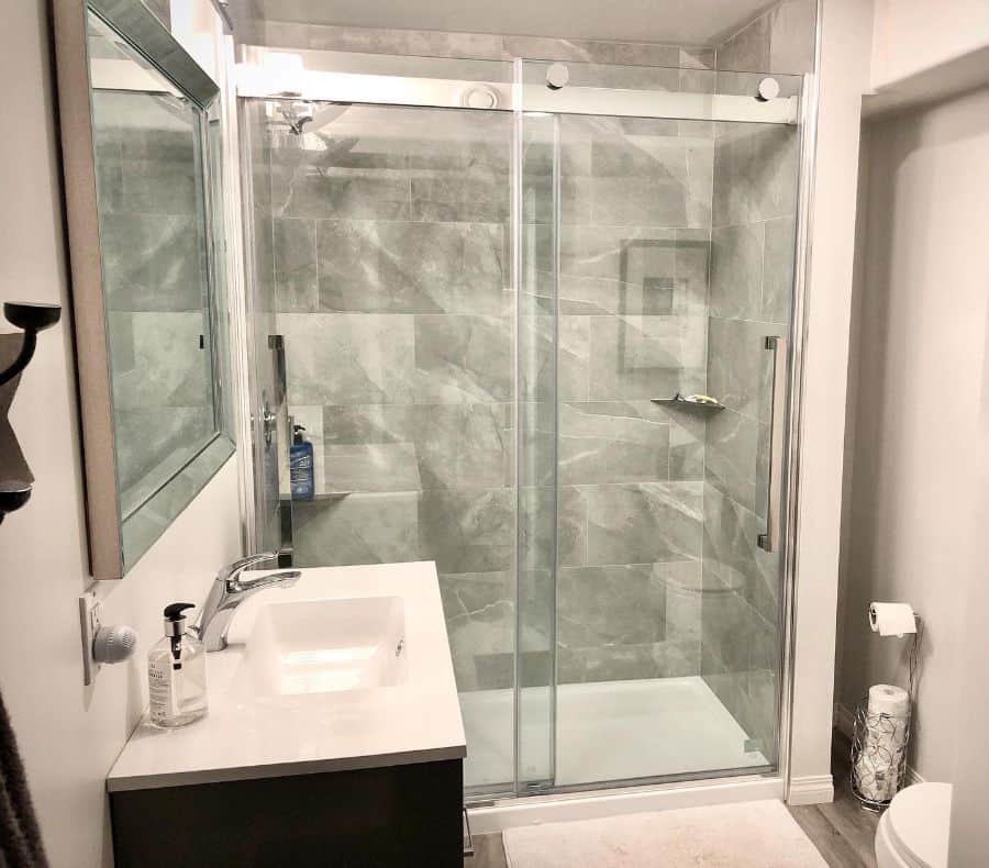 basement bathroom with marble wall