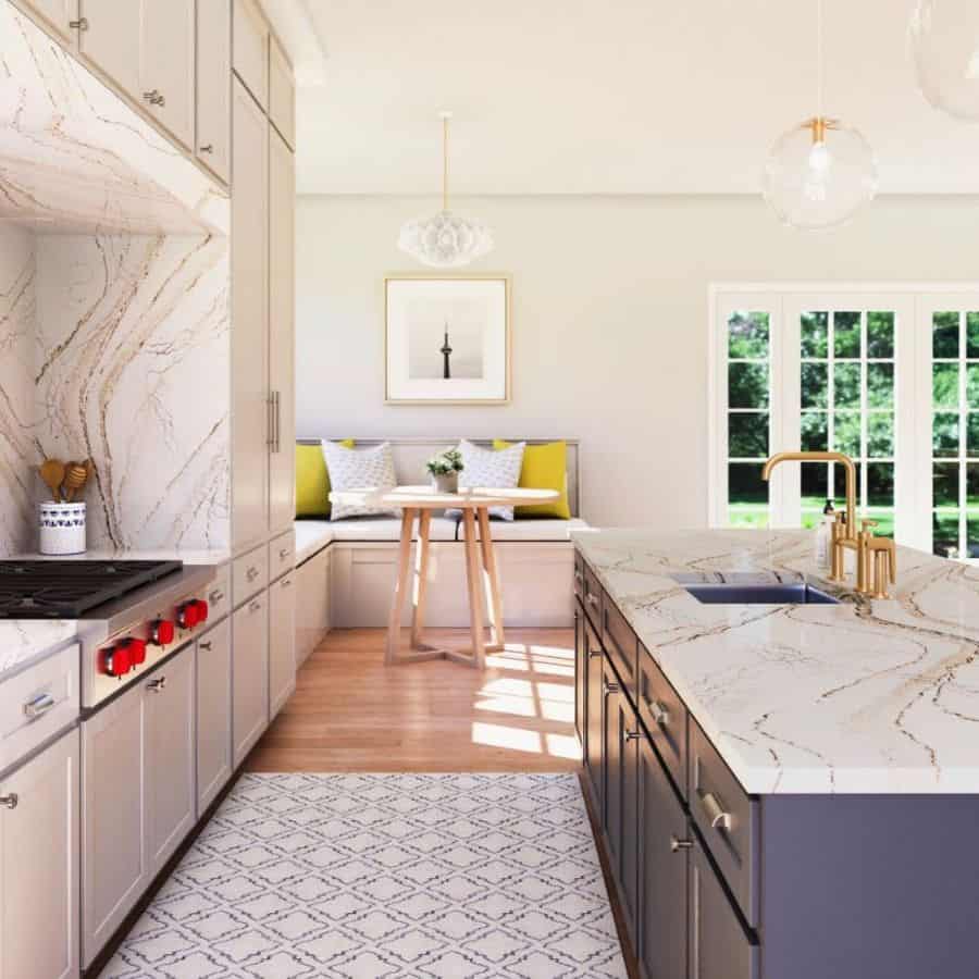 galley kitchen with blue cabinet island with marble top