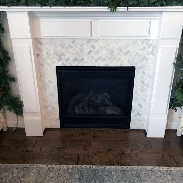 herringbone-patterned fireplace tiles