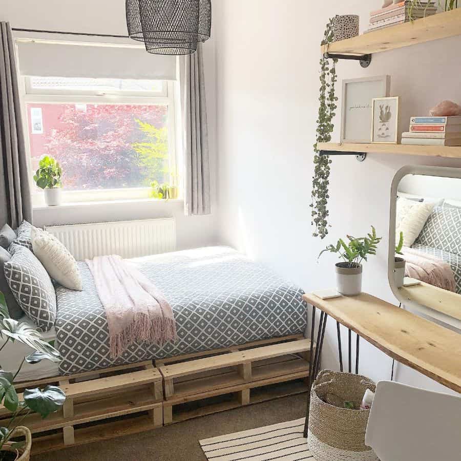 small rustic bedroom with wood pallet bed 