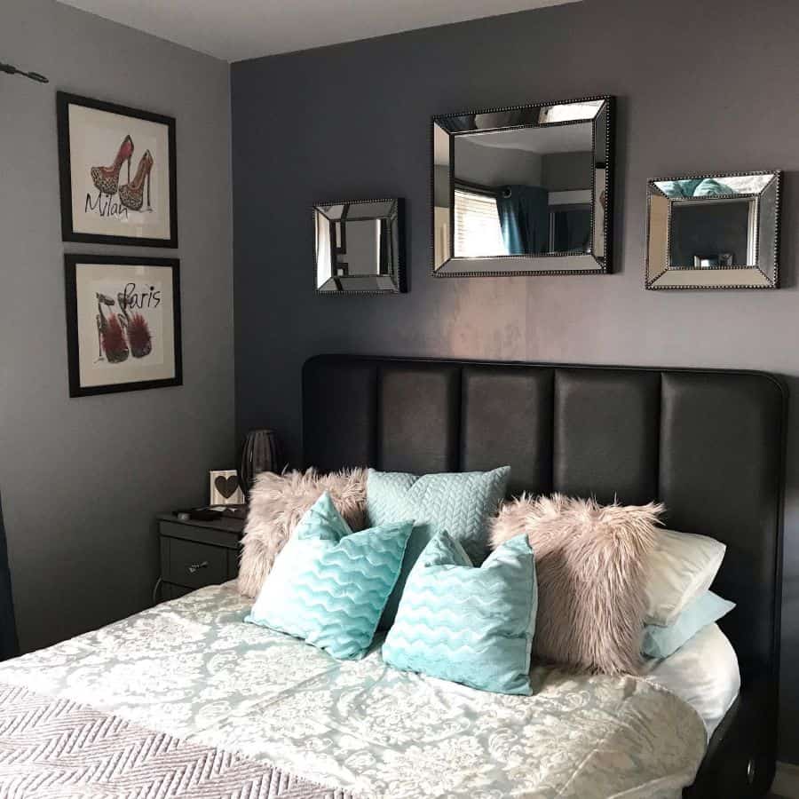 stylish small bedroom with black bed