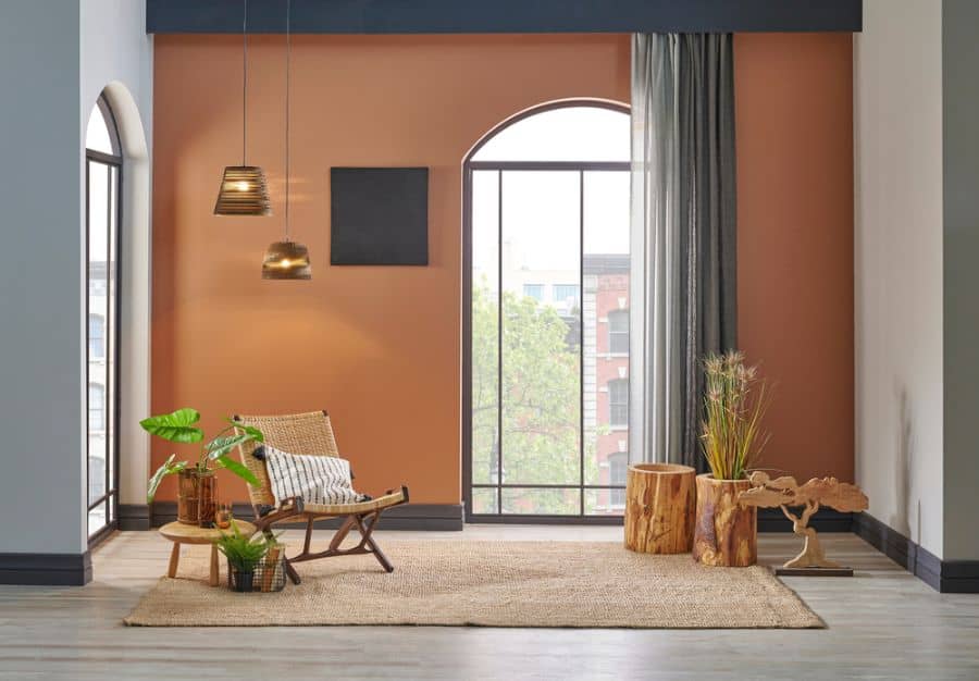 apartment living room with orange accent wall