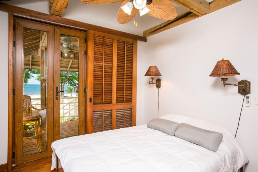 holiday home bedroom with balcony open to the beach 