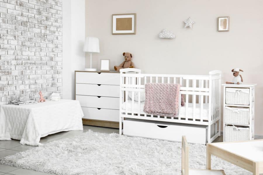 exposed brick feature wall in nursery