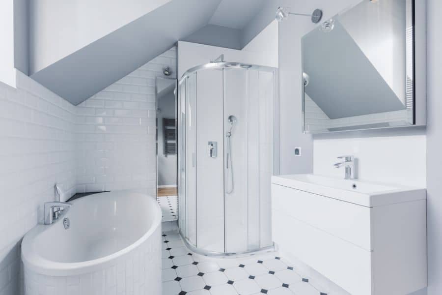 large white bathroom with glass shower and white tub